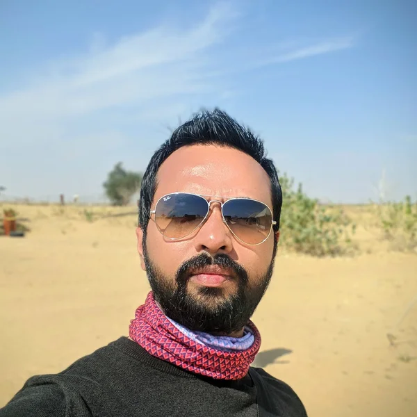 Mayank Suman on a desert trip, wearing aviator sunglasses
